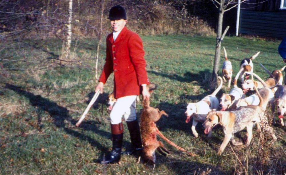 Hunts-person with dead fox