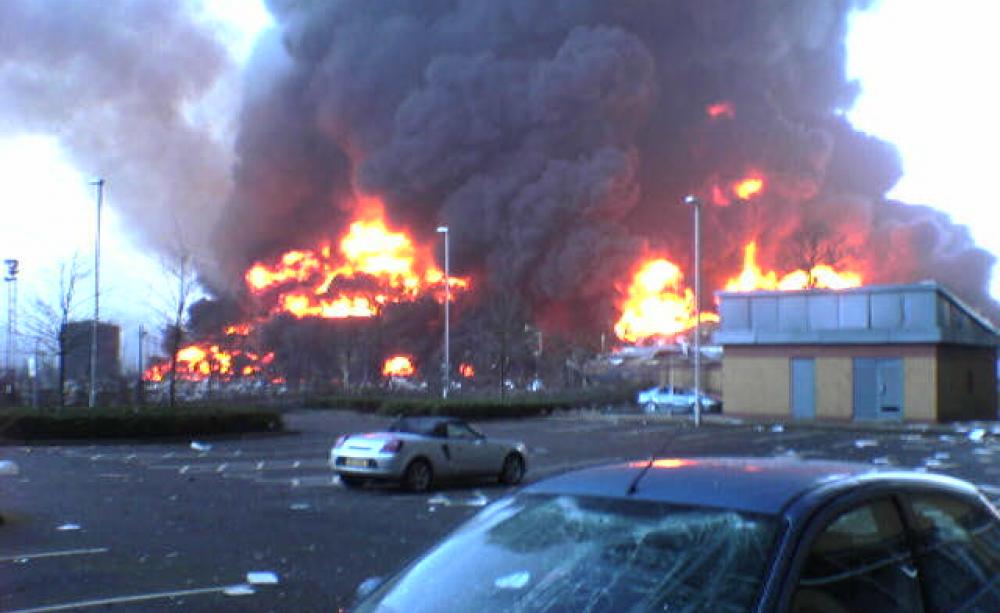 A building on fire in the background