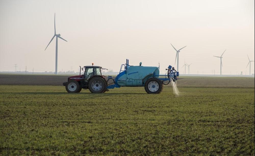 Tractor spraying fertiliser