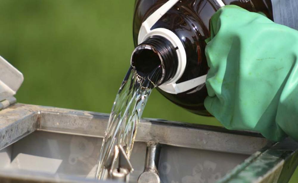 Pesticide being poured