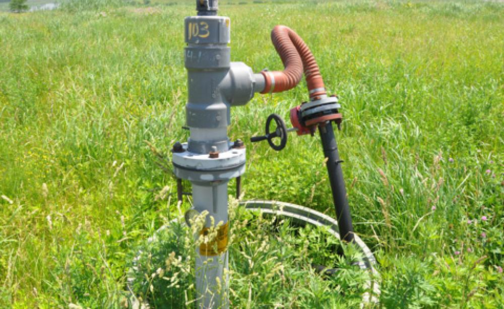A gas gauge in a meadow in FreshKills park