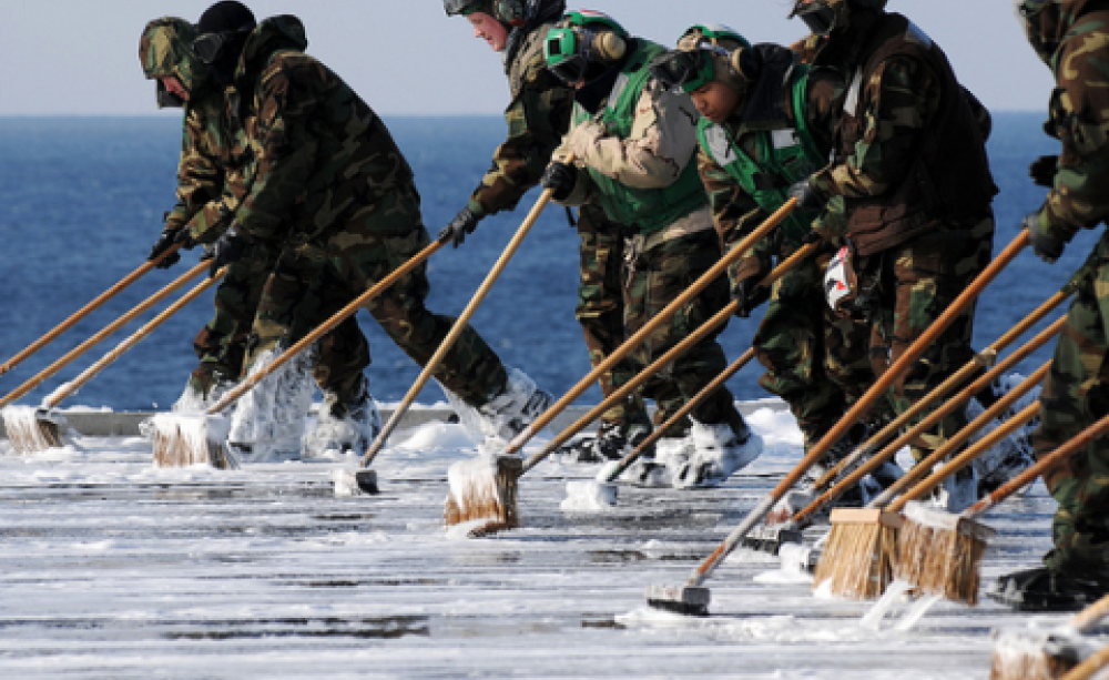 Sailors decontaminate the flight deck aboard USS Ronald Reagan, March 23 2011. Official U.S. Navy Page / Kevin B. Gray via Flickr.com.