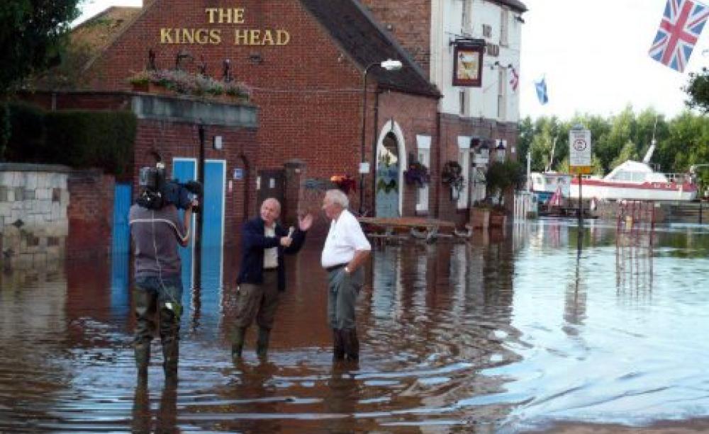 ITV interviews a victim of the flooded Severn in 2007. Photo: Wikimedia Commons via Open Democracy.