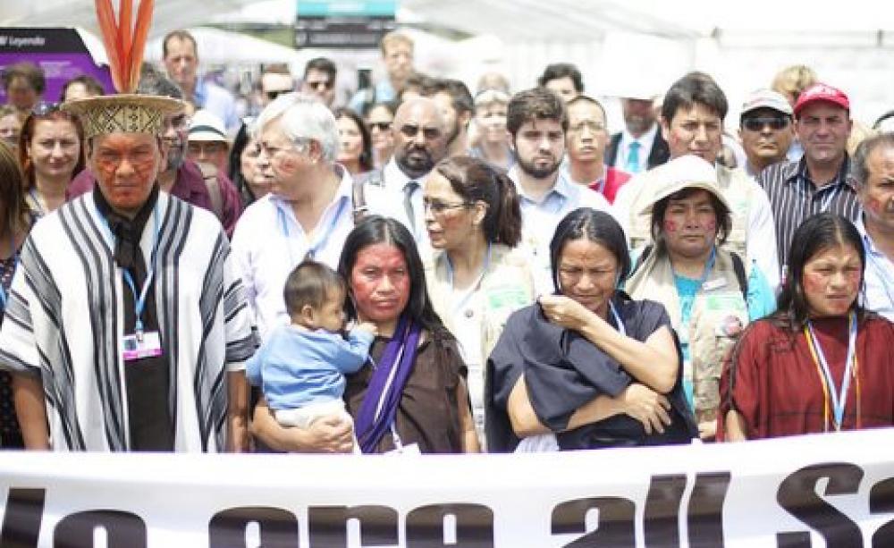 At COP20 in Lima, Indigenous protestors from Saweto in the Peruvian Amazon protest at ongoing land grabs and murder of their leadeat the COP20 in Lima, Peru. Photo: Luka Tomacrs / Friends of the Earth International.
