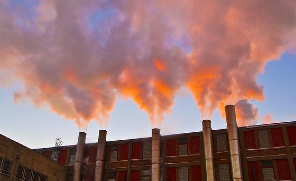 Industrial fumes caught in early morning sunshine in Chilwaukee, Wisconsin. Photo: Light Brigading via Flickr (CC BY-NC 2.0).