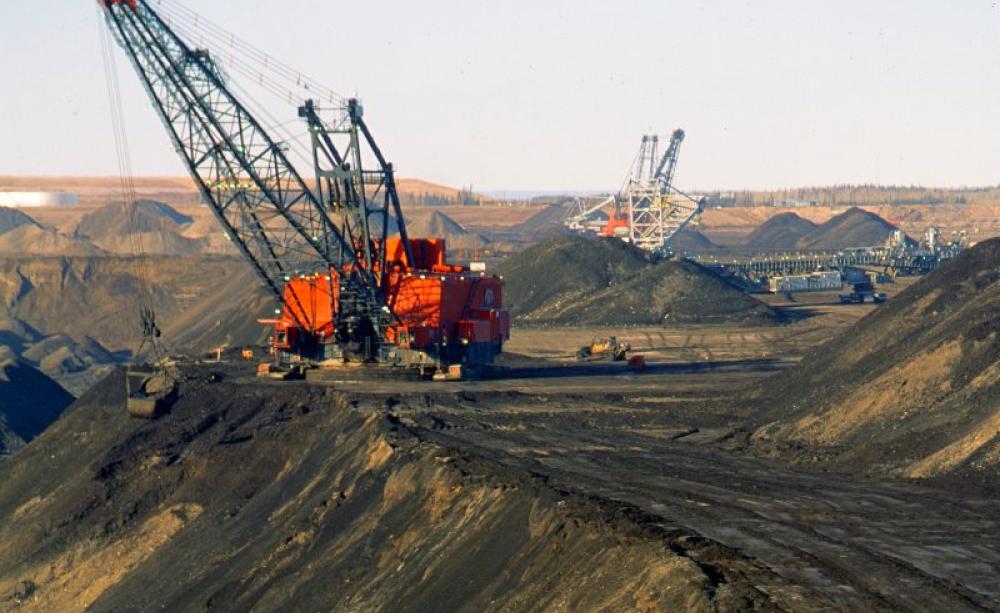 Despite the exploitation of unconventional oil resources like high-cost tar sands (pictured in Canada) and shales, peak oil really is upon us. Photo: Gord McKenna via Flickr (CC BY-NC-ND).