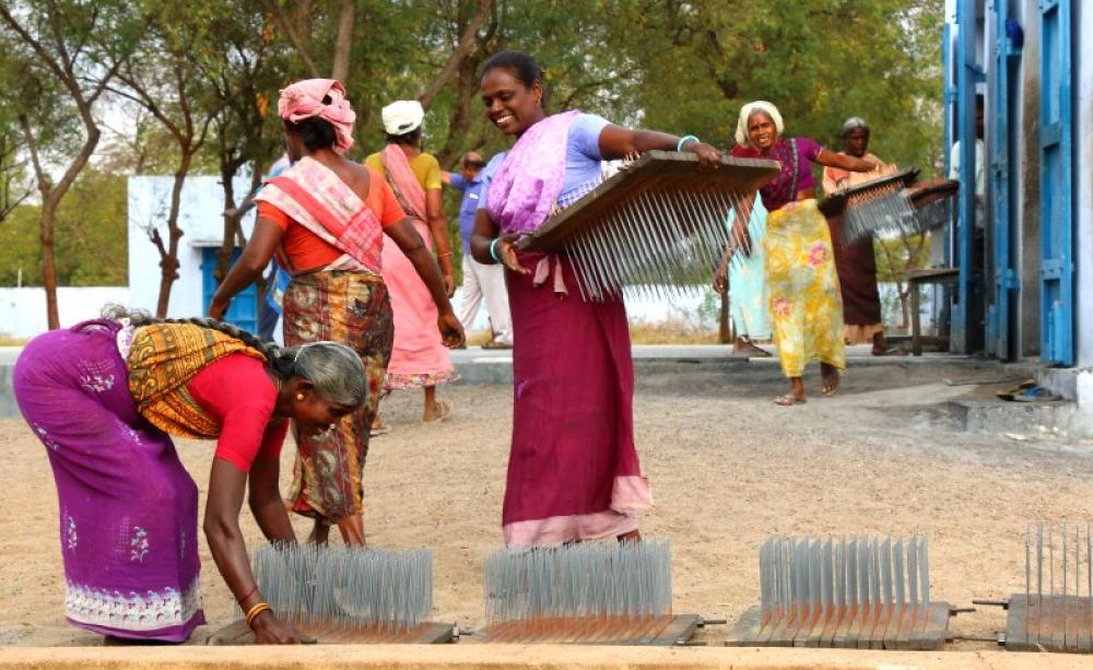 Women in India preparing to dry their farm produce using Sunbest equipment. Photo: Ashden.