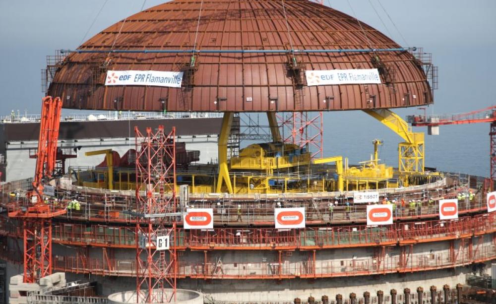 EDF puts in place the reactor dome on the Flamville 3 EPR reactor in July 2013. But sadly it failed to make sure the reactor vessel that sits at its heart was up to scratch first. And it's not - it has serious metallurgical flaws that could end up sinking
