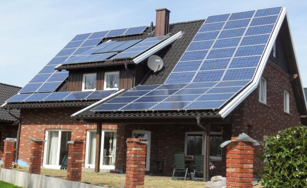 Solar and wind power are everywhere in Germany, putting the country on course for a 100% renewable electricity system by 2020. Photo: Tim Fuller via Flickr (CC BY).