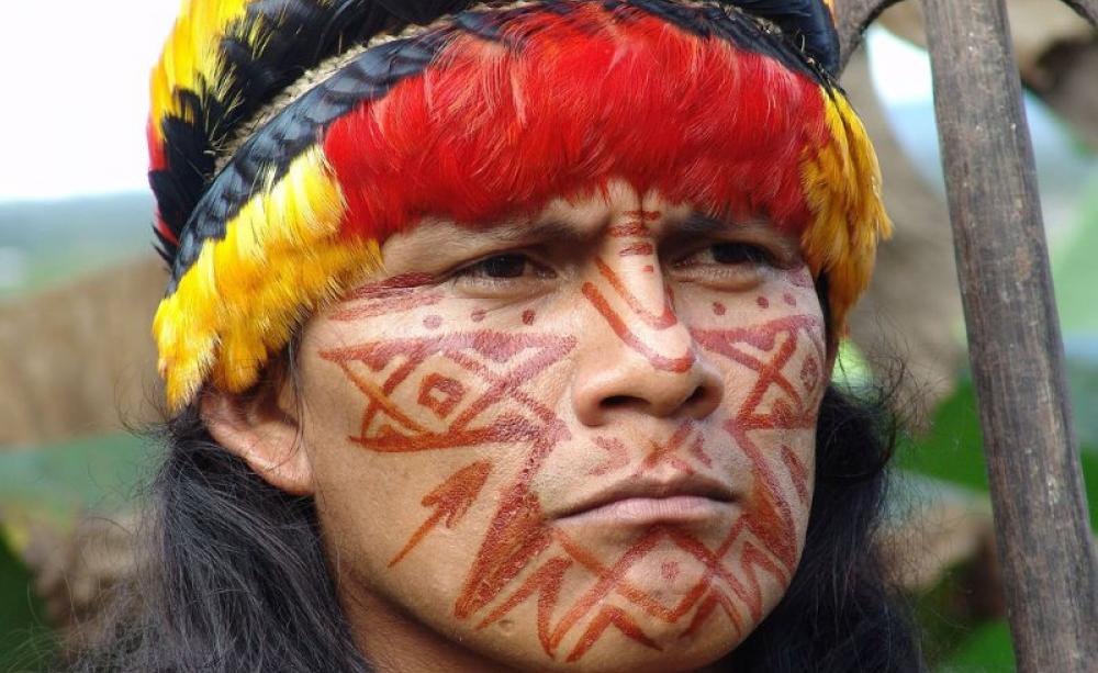 Portrait of Shuar Indian in Ecuador's Amazon, where gross violations of human and environmental rights have been committed by oil companies. Photo: 00rini hartman via Flickr (CC BY-NC-SA).