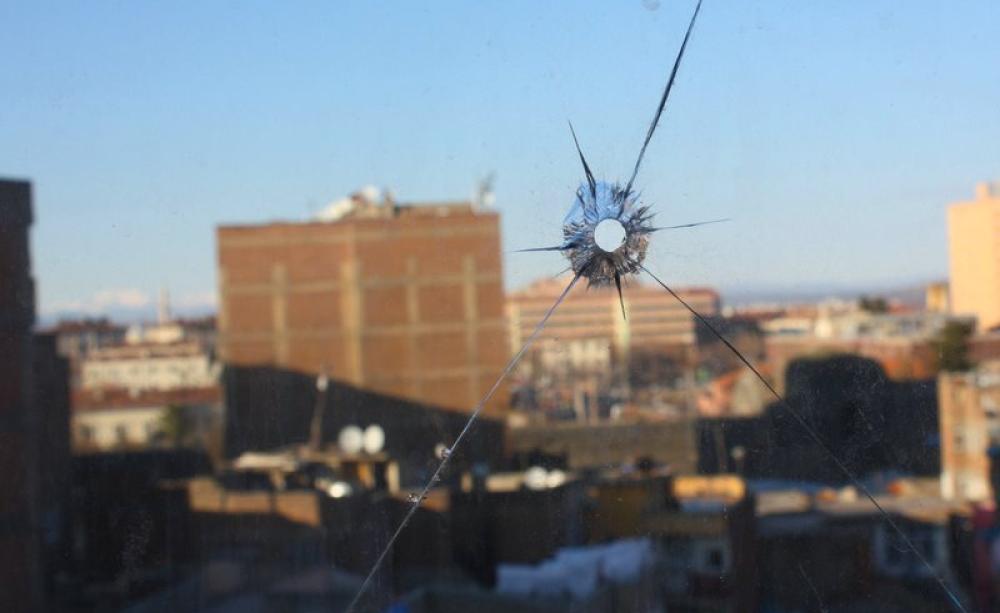 View from Diyarbakir hotel window, with bullet hole. Photo: William John Gauthier via Flickr (CC BY-SA).