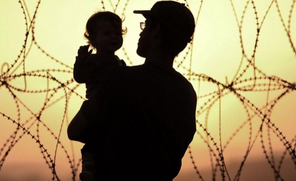 A young Jewish family watch the sun set over the West Bank from their settlement in Occupied Palestine. Photo: Rusty Stewart via Flickr (CC BY-NC-ND).
