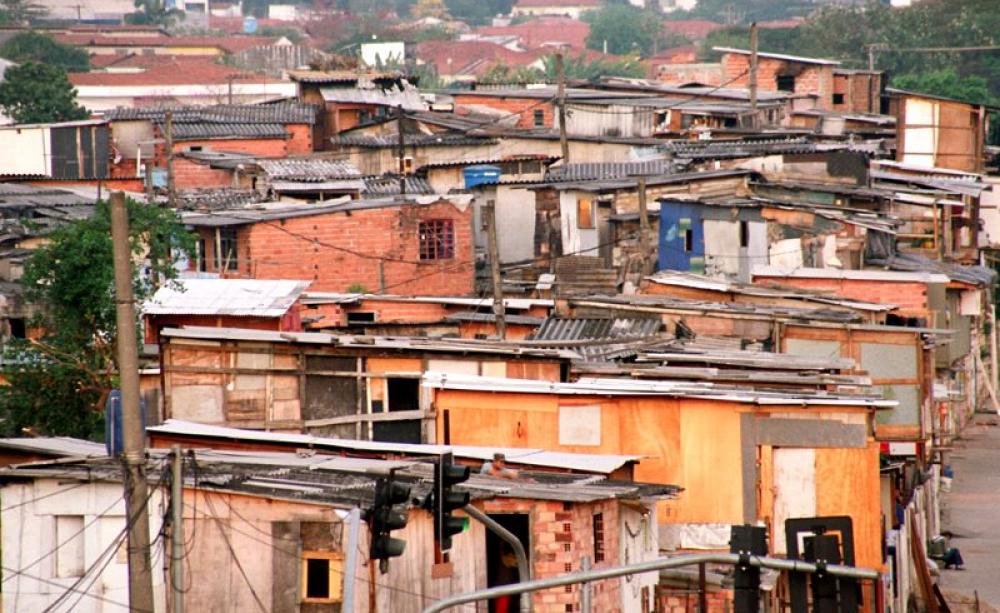 The densely conditions in Brazil's 'favelas', like this one in São Paulo, and the need for water tanks and containers, create idea conditions for Aedes mosquitos. And as the world warms, the mosquitos' range is expanding. Photo: Fernando Stankuns via Fli