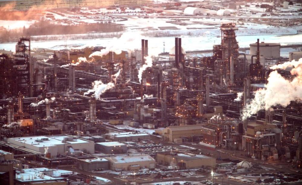 It may be possible to transform this landscape into a green energy park, or back to wilderness - but it's not going to happen soon enough without a corresponding political transformation! Tar sands refinery at Fort McMurray, Alberta, Canada. Photo: kris k