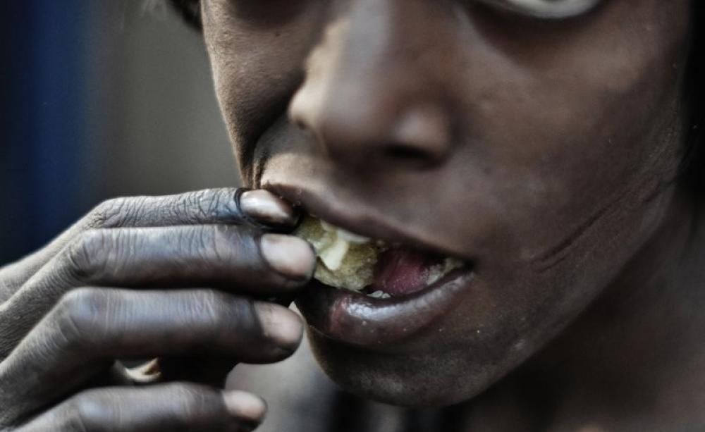 Hunger: a street-dweller in New Delhi, India. Photo: johnjodeery via Flickr (CC BY).