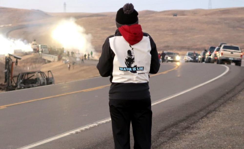 Tensions on the bridge at Standing Rock. Photo: Colin Samson, Author provided.