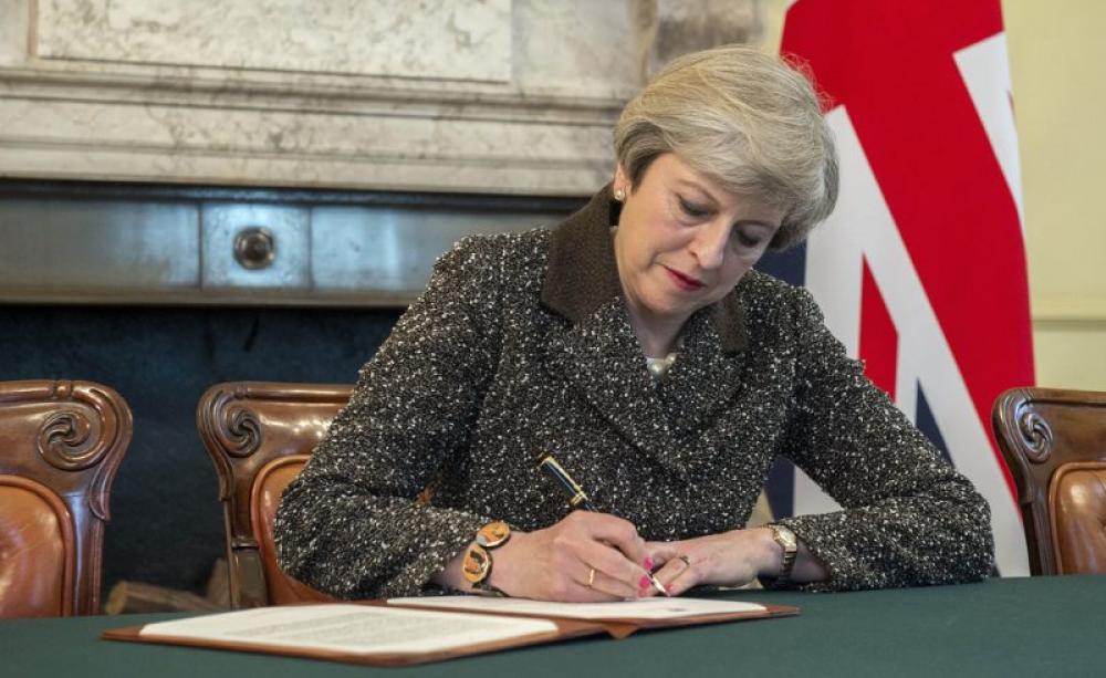 Prime Minister Theresa May signed her Article 50 setting out the UK's intention to withdraw from the European Union, 28th March 2017. Photo: Jay Allen / Number 10 via Flickr (CC BY-NC-ND).