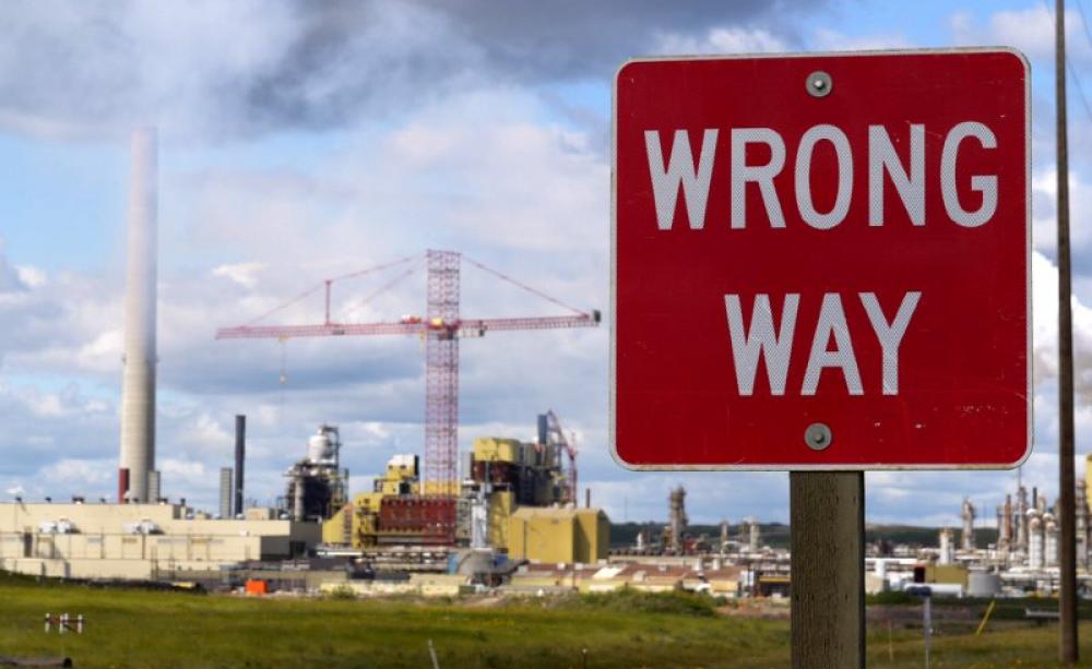 'Wrong way!' Roadside view of Alberta tarsands processing plant. Photo: Velcrow Ripper via Flickr (CC BY-NC).