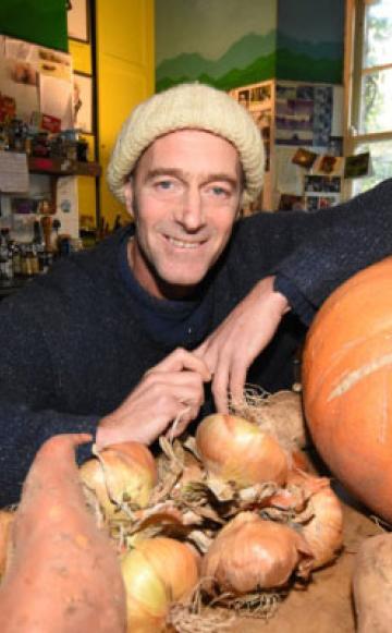 Hector Christie, with vegetables grown at the garden at his Tapeley Park estate and farm.