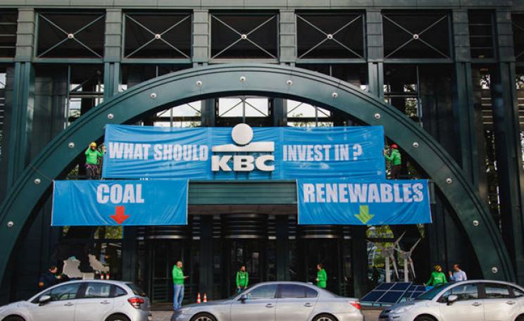 Greenpeace activists revamp the entry of the KBC bank building