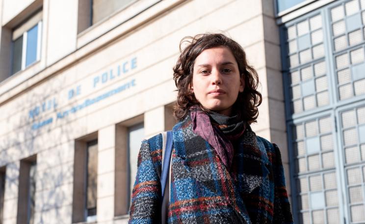  Marion Esnault, an activist who has taken down three portraits of Macron, outside a police station in Paris