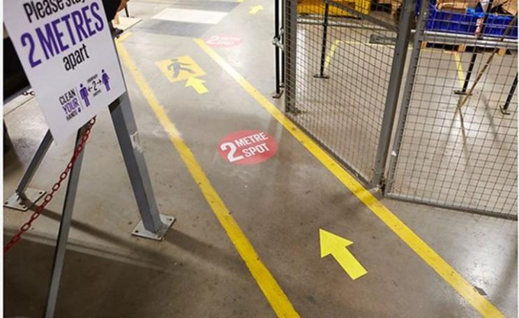 Markings on the floor in a warehouse will help workers with social distancing
