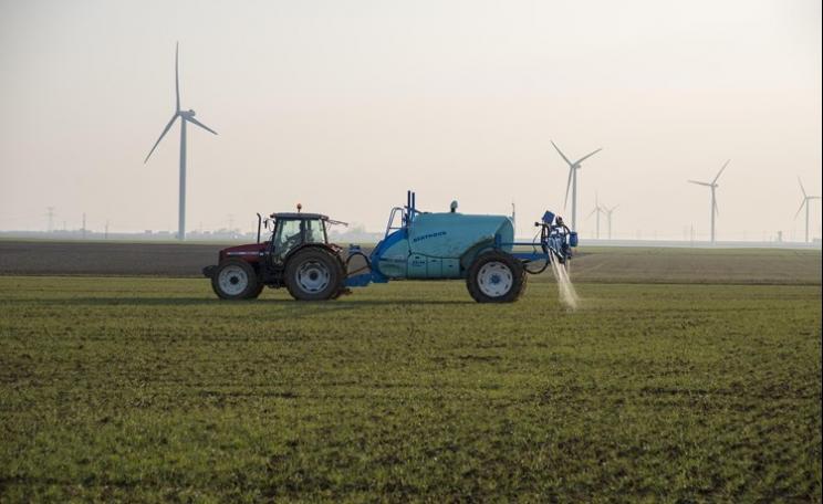 Tractor spraying fertiliser