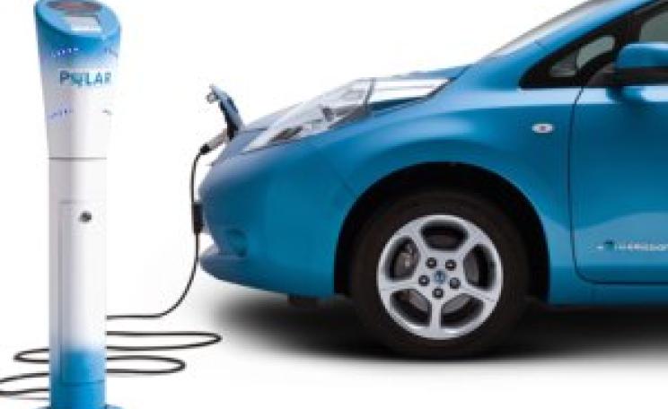 Electric car charging at charging point