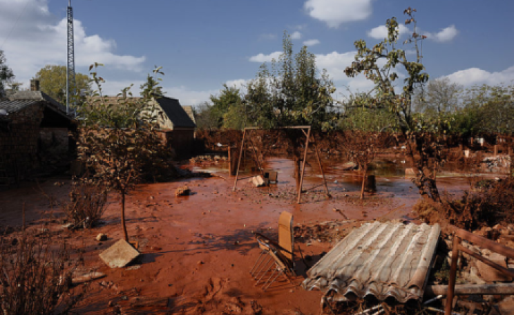 Ecocide: Ajka, Hungary, October 2010. 'Red sludge' alumina plant accident. Photo: Ministry of Public Administration and Justice / Wikimedia Commons.