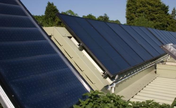 Regular PV solar cells on the Brighton Earthship in the south of England  Dominic Alves, CC BY-SA.