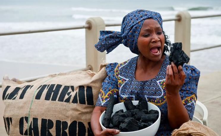 Let them eat carbon! At the 2011 UN climate summit in Durban, South Africa. Photo: Ainhoa Goma / Oxfam International via Flickr (CC BY-NC-ND 2.0).
