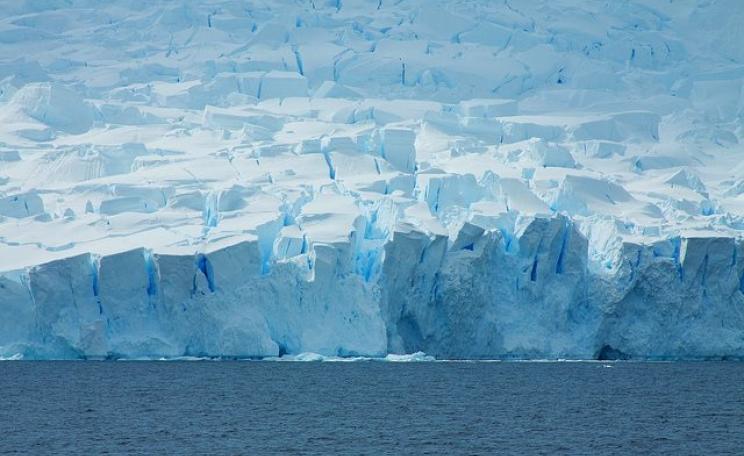 Where ice meets ocean - Antarctic coastline by McKay Savage via Flickr (CC BY 2.0).