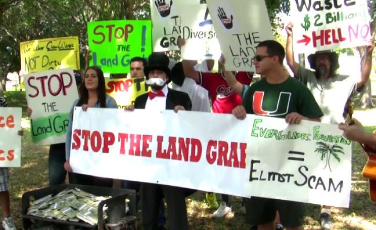 A 'money-burning' event organised by the Miami Tea Party to oppose a 46,000 acre conservation land purchase - but were the 'protestors' all actors? So it would seem. Photo: from Youtube video by Miami Tea Party.
