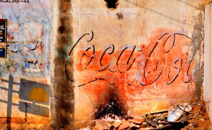 It will take more than PR puff to restore Coca-Cola's reputation in India. Wall-painted sign in Bangalore, India. Photo: Syed Nabil Aljunid via Flickr (CC BY-NC).