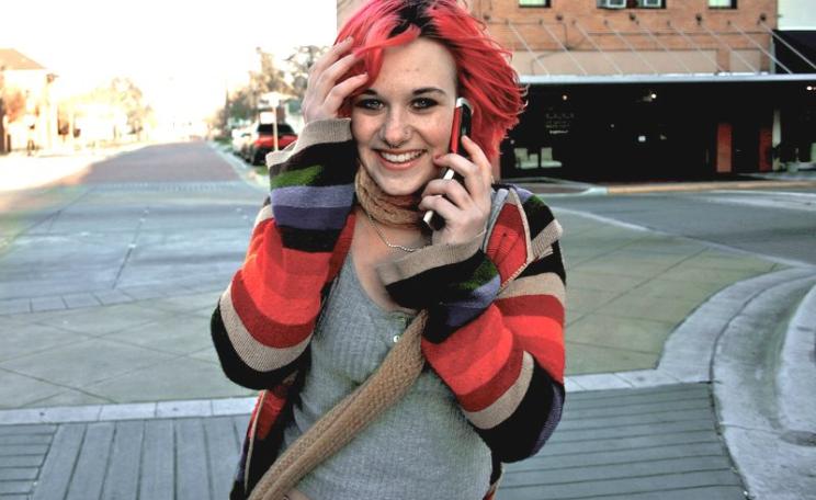 Cell phone user in downtown Deland, Florida. Photo: austinhumphreys via Flickr (CC BY-ND).