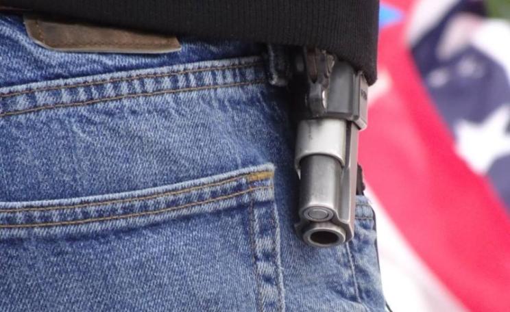At a memorial for killed occupier LaVoy Finicum, guns were openly displayed. Photo: Peter Walker.