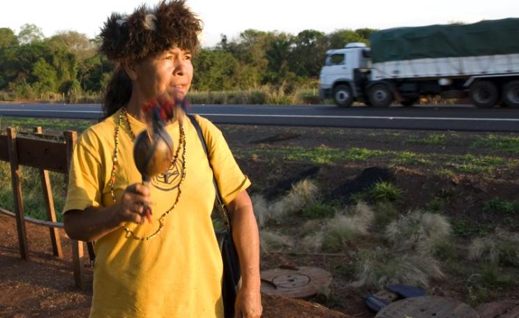 A Guarani woman at the roadside. Photo: Survival International.
