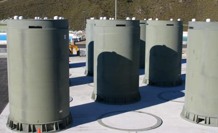 Dry casks for storing irradiated nuclear fuel at the Diablo Canyon plant in Avila, California. The plant is scheduled to close within a decade, but taxpayers will pay to keep spent fuel stored on-site until a federal repository is ready to take it. Photo: