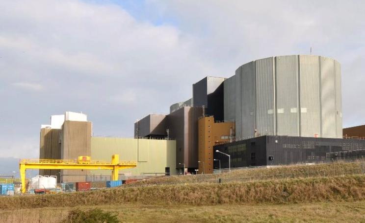To stop any more of these, we must attack the scientific deception that underlies the industry. Nuclear power station, Wylfa, Wales. Photo: Jeremy WILLIAMS via Flickr (CC BY-NC).
