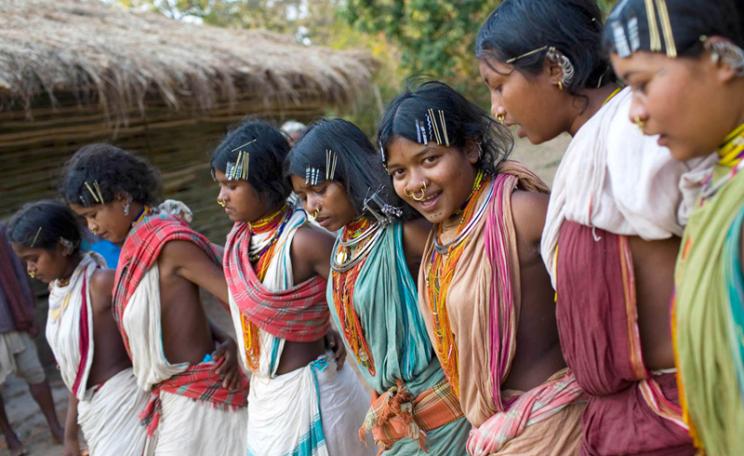 17 year old, Almay (3rd from right) dances with other tribal girls during the mass worship in Ijurupa village near Vedanta refinary in Orrisa. Indigenous communities conduct the worship, which is an annual feature, in their respective states, but this yea